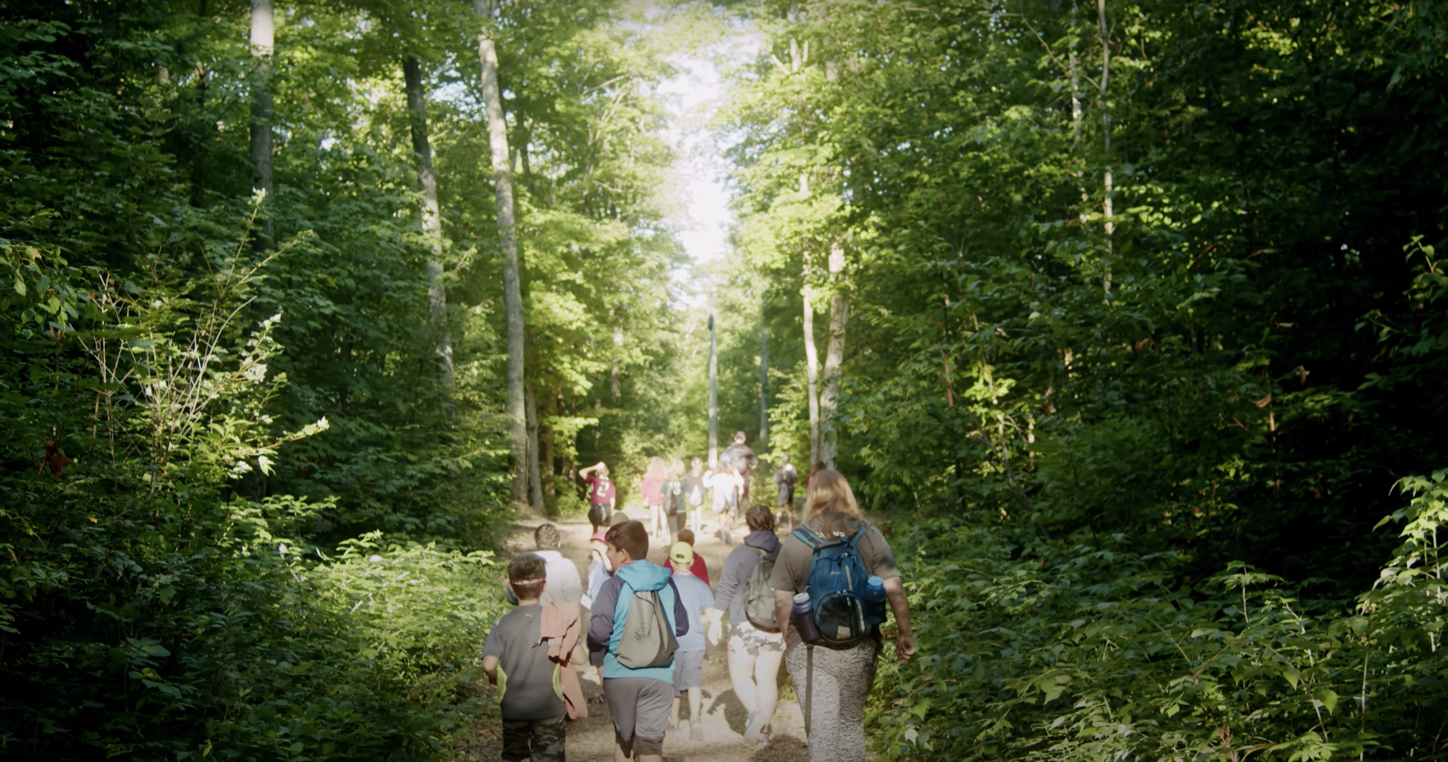 Group of young people walking through nature
