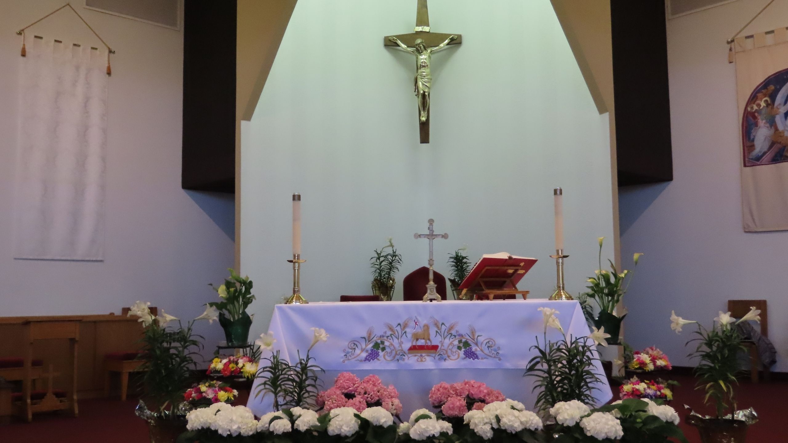 Altar of church with lots of flowers