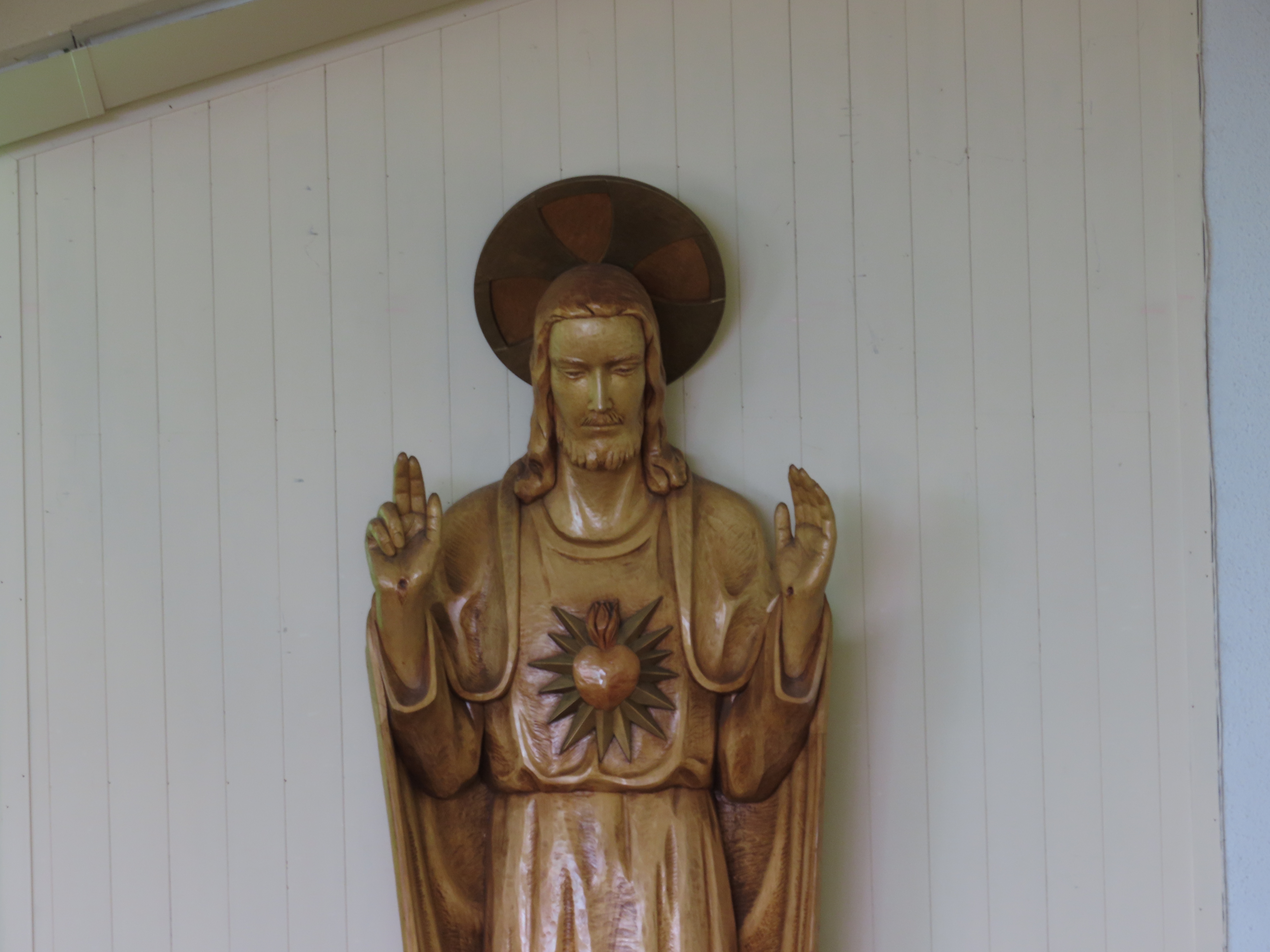 Wooden statue depicting the Sacred Heart of Jesus